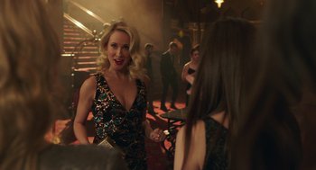 Movie still from “Pitch Perfect 3” (2017), directed by Trish Sie – A woman in a black dress talking to another woman in a black dress; Medium shot, Over the shoulder angle