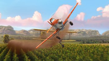 Movie still from “Planes” (2013), directed by Klay Hall – An orange and white airplane flying over a field; Wide shot, Low angle