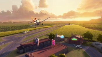 Movie still from “Planes” (2013), directed by Klay Hall – An airplane is flying over an airport runway at sunset; Extreme Wide shot, High angle