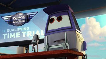 Movie still from “Planes” (2013), directed by Klay Hall – A cartoon character is sitting at a podium with a microphone in front of him; Medium shot, Low angle