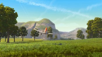 Movie still from “Planes” (2013), directed by Klay Hall – An airplane is flying over a grassy field; Extreme Wide shot, Low angle