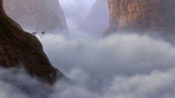 Movie still from “Planes” (2013), directed by Klay Hall – A man flying through the air while standing on top of a cliff; Extreme Wide shot, Low angle