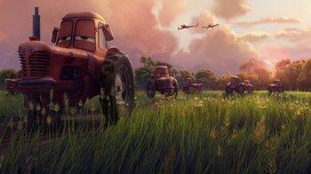 Movie still from “Planes” (2013), directed by Klay Hall – An image of an airplane flying in the sky over a field; Wide shot, Low angle