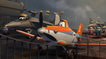 Movie still from “Planes” (2013), directed by Klay Hall – A plane with a propeller sitting on top of a runway; Wide shot, Low angle