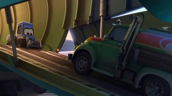 Movie still from “Planes” (2013), directed by Klay Hall – A green car is parked on the side of the road; Wide shot, Low angle