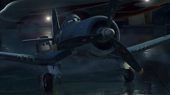 Movie still from “Planes” (2013), directed by Klay Hall – An airplane is parked in a hangar at night; Extreme Wide shot, High angle