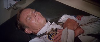 Movie still from “Planet of the Apes” (1968), directed by Franklin J. Schaffner – A person laying on a couch; Close Up shot, Overhead angle