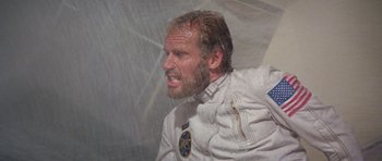 Movie still from “Planet of the Apes” (1968), directed by Franklin J. Schaffner – A person wearing a suit and tie; Close Up shot, Low angle