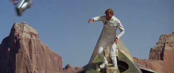 Movie still from “Planet of the Apes” (1968), directed by Franklin J. Schaffner – A man riding a skateboard on top of a ramp; Wide shot, Low angle