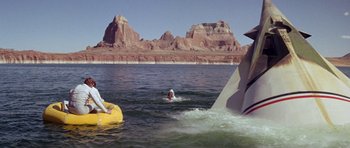 Movie still from “Planet of the Apes” (1968), directed by Franklin J. Schaffner – A person in the middle of a body of water; Extreme Wide shot, High angle