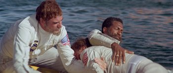 Movie still from “Planet of the Apes” (1968), directed by Franklin J. Schaffner – Three men in white shirts are on a body of water; Medium shot, High angle