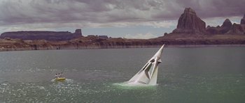 Movie still from “Planet of the Apes” (1968), directed by Franklin J. Schaffner – A sailboat in the middle of a body of water; Extreme Wide shot, High angle