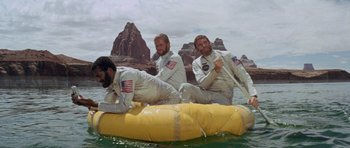 Movie still from “Planet of the Apes” (1968), directed by Franklin J. Schaffner – A group of men on a raft in the water; Wide shot, High angle