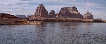 Movie still from “Planet of the Apes” (1968), directed by Franklin J. Schaffner – A body of water surrounded by a mountain range; Extreme Wide shot, High angle