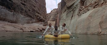 Movie still from “Planet of the Apes” (1968), directed by Franklin J. Schaffner – A group of people in a raft in a river; Wide shot, Overhead angle