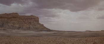 Movie still from “Planet of the Apes” (1968), directed by Franklin J. Schaffner – A large rock formation in the middle of the desert; Extreme Wide shot, Low angle
