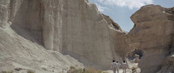 Movie still from “Planet of the Apes” (1968), directed by Franklin J. Schaffner – A group of people walking up a mountain side; Extreme Wide shot, Low angle
