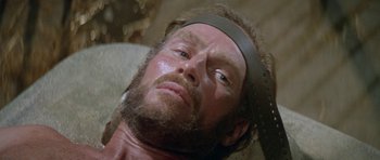 Movie still from “Planet of the Apes” (1968), directed by Franklin J. Schaffner – A person wearing a headband; Close Up shot, High angle