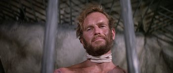 Movie still from “Planet of the Apes” (1968), directed by Franklin J. Schaffner – A person with a beard; Close Up shot, Low angle