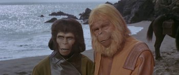 Movie still from “Planet of the Apes” (1968), directed by Franklin J. Schaffner – A couple of people that are standing next to each other; Close Up shot, High angle