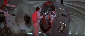 Movie still from “Planet of the Apes” (2001), directed by Tim Burton – A man standing in front of a mirror in a room; Wide shot, High angle