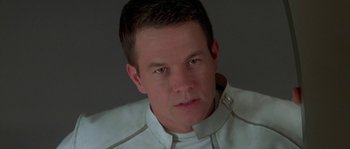 Movie still from “Planet of the Apes” (2001), directed by Tim Burton – A person wearing a white shirt; Close Up shot, Over the shoulder angle