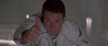 Movie still from “Planet of the Apes” (2001), directed by Tim Burton – A man holding a cell phone up to his ear; Close Up shot, Low angle