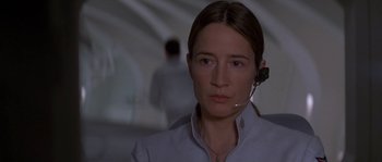 Movie still from “Planet of the Apes” (2001), directed by Tim Burton – A woman with a headset on looking at the camera; Close Up shot, Low angle