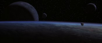 Movie still from “Planet of the Apes” (2001), directed by Tim Burton – An image of an earth and a moon in space; Extreme Wide shot, Overhead angle