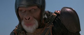 Movie still from “Planet of the Apes” (2001), directed by Tim Burton – A person wearing a helmet; Close Up shot, Low angle