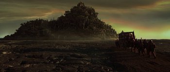 Movie still from “Planet of the Apes” (2001), directed by Tim Burton – An image of an image of a castle in the middle of the night; Extreme Wide shot, Low angle