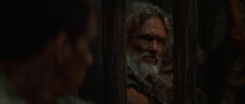 Movie still from “Planet of the Apes” (2001), directed by Tim Burton – An old man with long white hair and a beard; Close Up shot, Over the shoulder angle