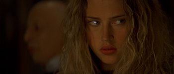 Movie still from “Planet of the Apes” (2001), directed by Tim Burton – A woman's face in the dark; Close Up shot, Over the shoulder angle