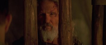 Movie still from “Planet of the Apes” (2001), directed by Tim Burton – An old man with a beard and a white beard; Close Up shot, Over the shoulder angle