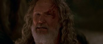 Movie still from “Planet of the Apes” (2001), directed by Tim Burton – An old man with a beard and a white beard; Close Up shot, Low angle