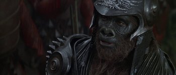 Movie still from “Planet of the Apes” (2001), directed by Tim Burton – A gorilla that is wearing a helmet; Close Up shot, High angle
