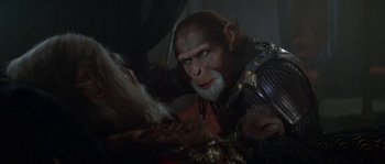 Movie still from “Planet of the Apes” (2001), directed by Tim Burton – An image of a man with a gorilla costume in a movie scene; Close Up shot, Over the shoulder angle