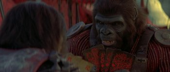 Movie still from “Planet of the Apes” (2001), directed by Tim Burton – A gorilla that is looking at a woman; Close Up shot, Over the shoulder angle