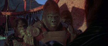 Movie still from “Planet of the Apes” (2001), directed by Tim Burton – Two people dressed up as apes in a circus; Close Up shot, Over the shoulder angle