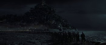Movie still from “Planet of the Apes” (2001), directed by Tim Burton – A group of people standing on top of a hill; Extreme Wide shot, High angle