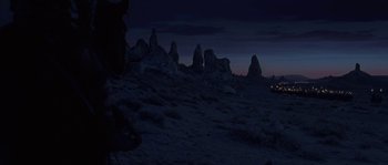 Movie still from “Planet of the Apes” (2001), directed by Tim Burton – A view of some rocks in the desert at night time; Extreme Wide shot, Low angle