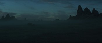 Movie still from “Planet of the Apes” (2001), directed by Tim Burton – A view of a mountain range at night with the sky in the background; Extreme Wide shot, High angle