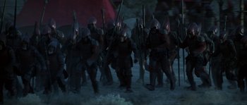 Movie still from “Planet of the Apes” (2001), directed by Tim Burton – A group of men in medieval garb are marching; Wide shot, High angle