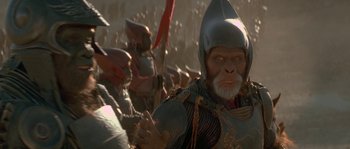 Movie still from “Planet of the Apes” (2001), directed by Tim Burton – A group of people dressed in medieval garb; Close Up shot, High angle