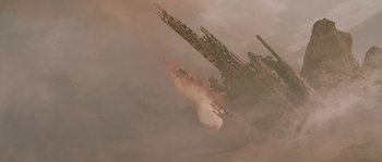 Movie still from “Planet of the Apes” (2001), directed by Tim Burton – An image of an airplane flying in the sky; Extreme Wide shot, Low angle