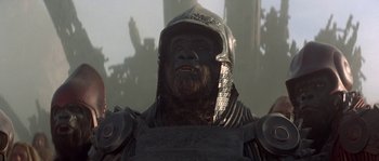 Movie still from “Planet of the Apes” (2001), directed by Tim Burton – An image of a man with a beard wearing a helmet; Close Up shot, Low angle