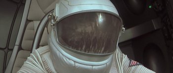 Movie still from “Planet of the Apes” (2001), directed by Tim Burton – A person wearing a space suit; Close Up shot, Overhead angle