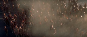 Movie still from “Planet of the Apes” (2001), directed by Tim Burton – A large group of people standing in the middle of a room; Extreme Wide shot, High angle