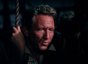 Movie still from “Plymouth Adventure” (1952), directed by Clarence Brown – A person holding a rope; Close Up shot, High angle