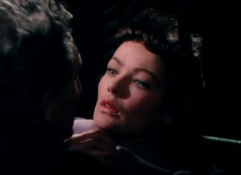 Movie still from “Plymouth Adventure” (1952), directed by Clarence Brown – A woman's face as a man looks on; Close Up shot, Over the shoulder angle